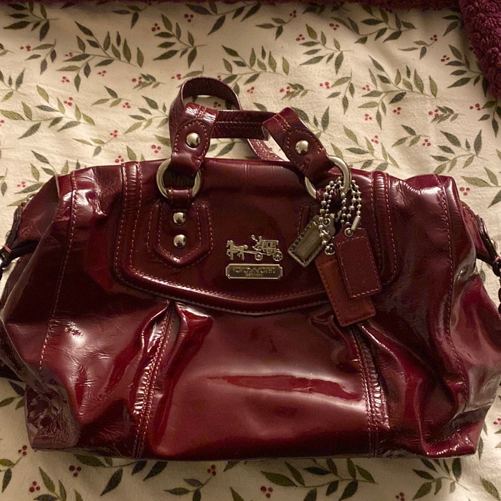 COACH patent leather bag. Gorgeous rich color with burgundy colored lining.